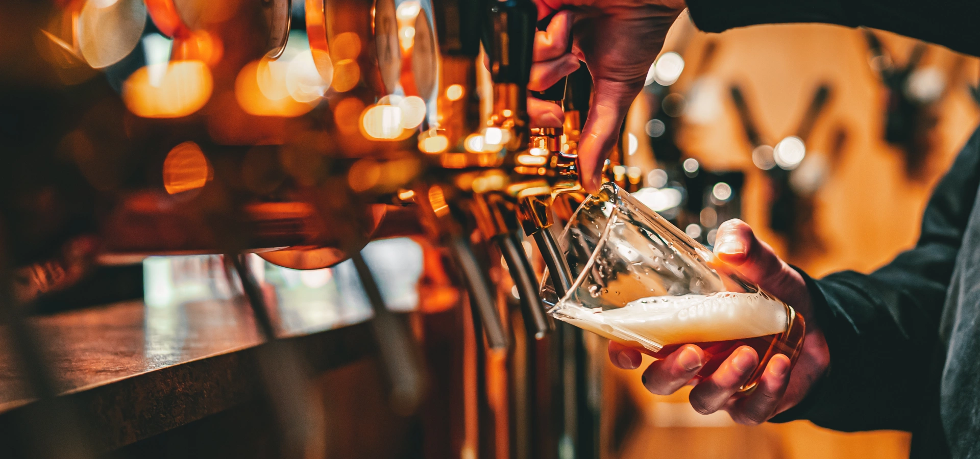 Beer being poured in a pub.