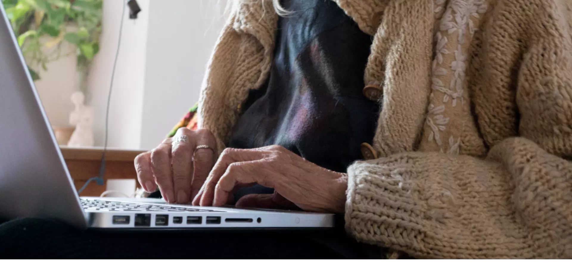 Old woman using a laptop.