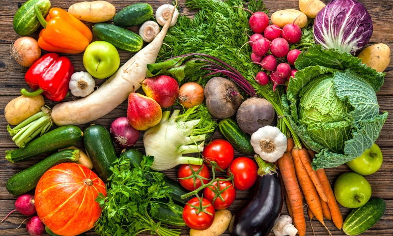 Spread of varied vegetables, including tomatoes, salads, aubergines, courgettes, etc.