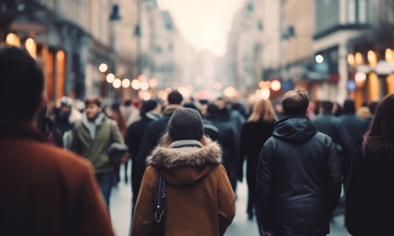 Crowd of people walking in a pedestrian street.