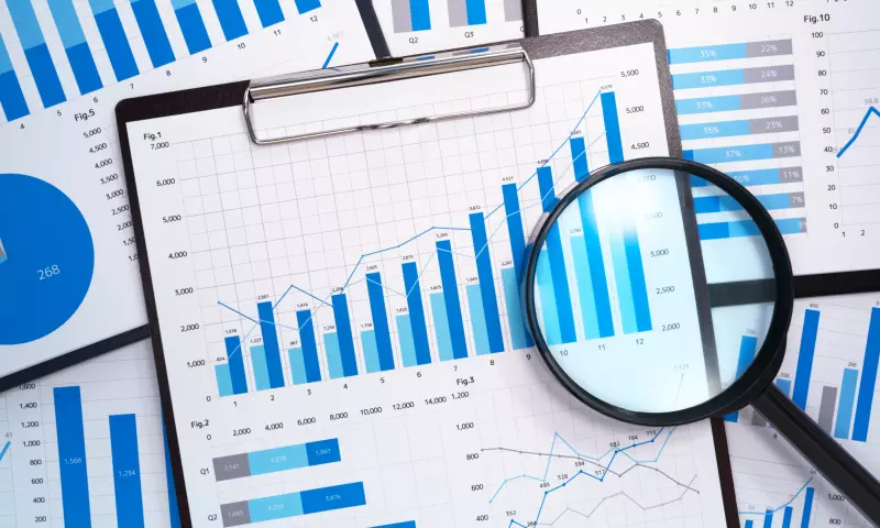 Series of graphs with a magnifying glass on top.