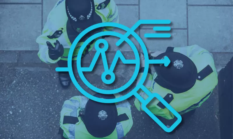 Three police officers photographed from above, with a magnifying glass icon on top signifying 'overview'.