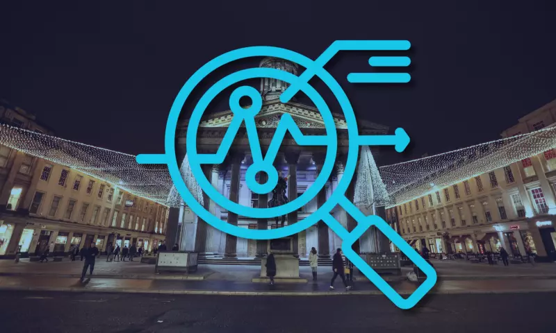 Glasgow Museum of Modern Art at night, with a magnifying glass icon on top signifying 'overview'.